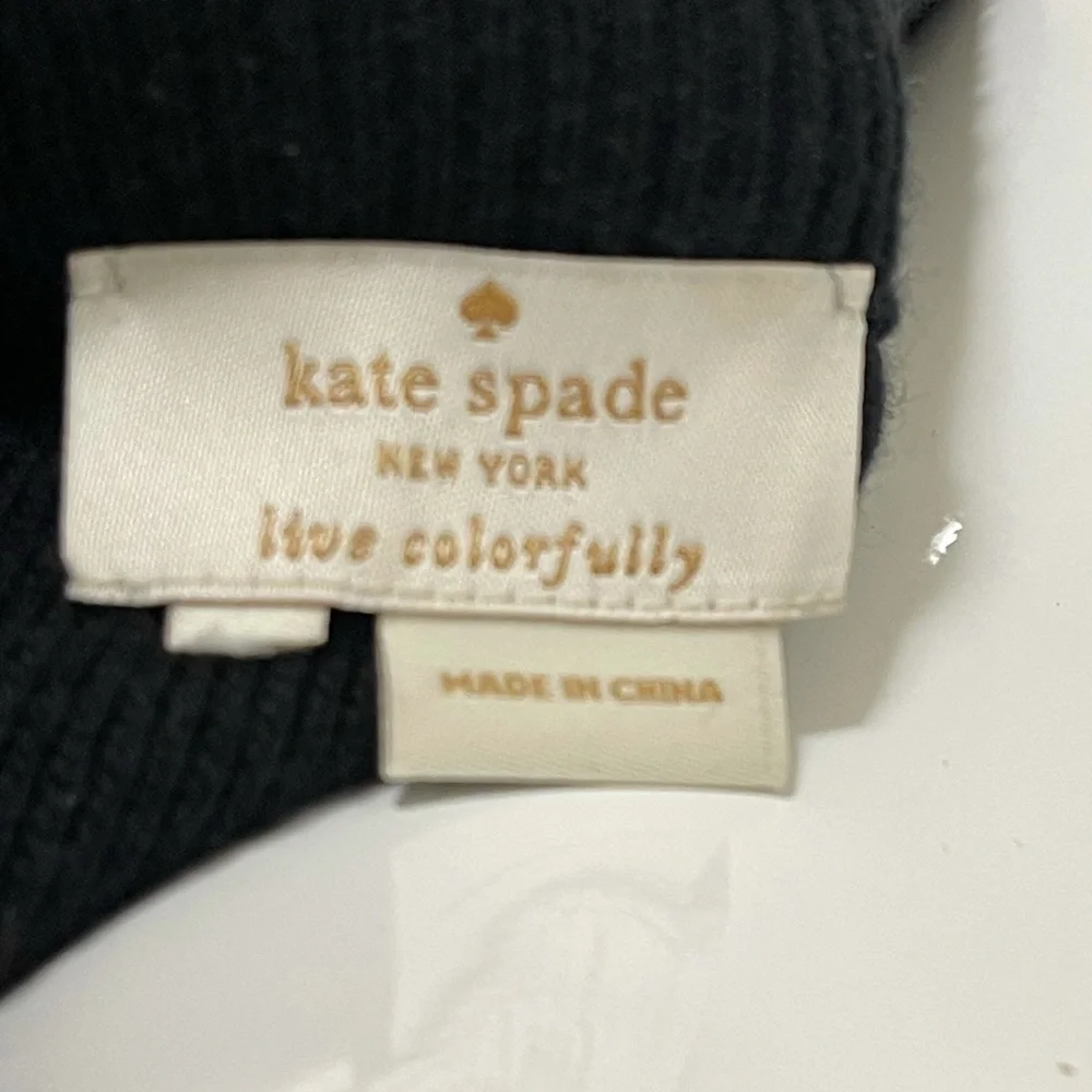 Kate spade black sweater. Looks like Front made with the unique sheep fur.